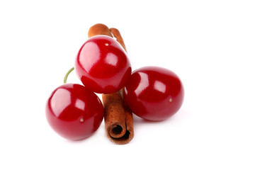 cherry and cinnamon isolated on white background