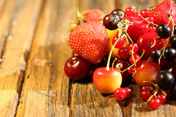 blurred berry mix  old wooden background rustic style vintage retro summer