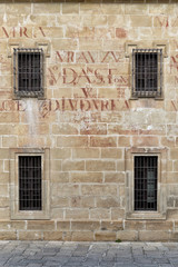 Fototapeta na wymiar Ancient facade with symmetrical windows, Baeza, Spain