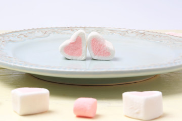 pair of heart marshmallow on a plate valentines day love romantic background