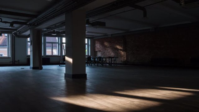 Time-lapse of sun rays moving over an empty rustic office space