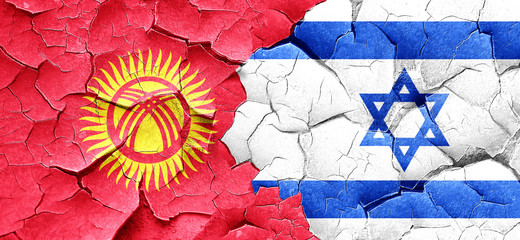 Kyrgyzstan flag with Israel flag on a grunge cracked wall