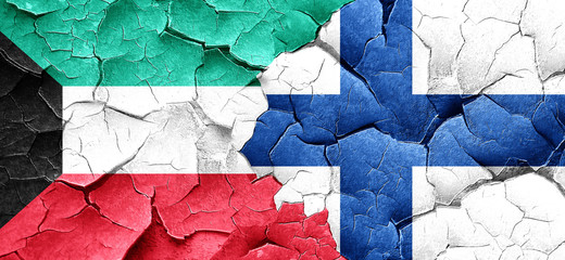 Kuwait flag with Finland flag on a grunge cracked wall