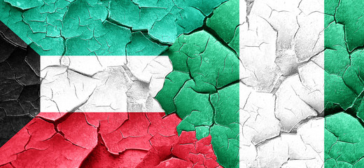 Kuwait flag with Nigeria flag on a grunge cracked wall
