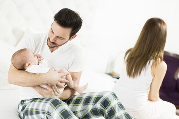 Happy family with newborn baby