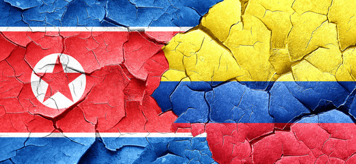 North Korea flag with Colombia flag on a grunge cracked wall