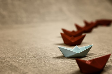 toned colored paper boats glass