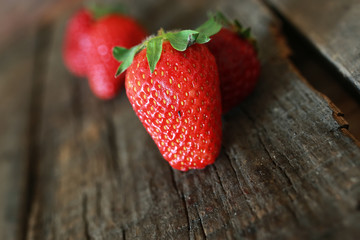 strawberries on a wooden background