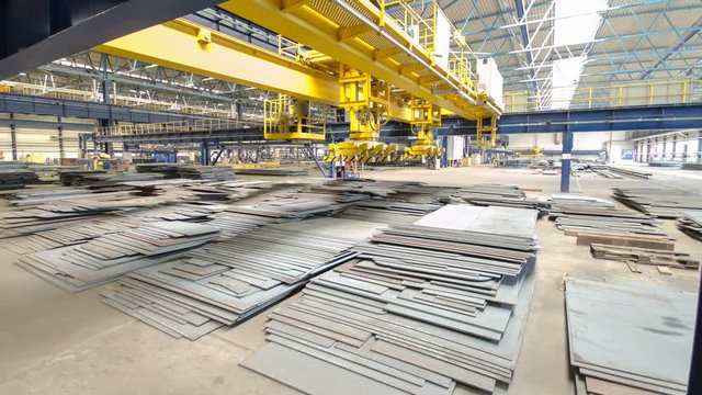 The operator lifting device timelapse hyperlapse, lift loads using lifting magnet, mechanical workshop, metal structures plant.