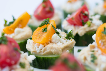 hummus bites with cucumber and tomatoes 