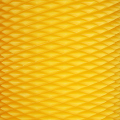 textured surface of yellow candle
