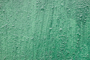 Cracking and peeling paint on a wall