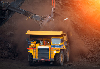 big mining truck unload coal in coal mine