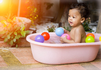 Asian baby Bathing in tubs