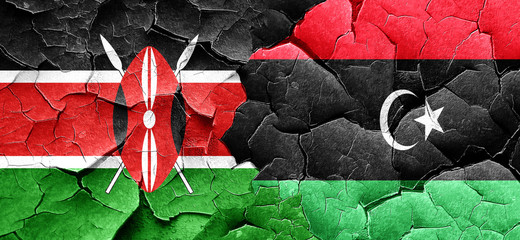 Kenya flag with Libya flag on a grunge cracked wall