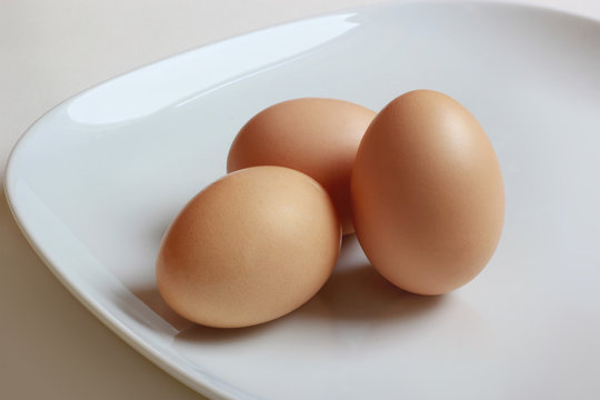3 eggs closeup on white plate - good choice on breakfast