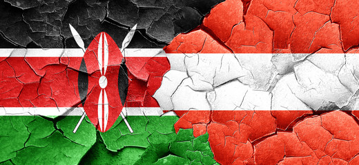 Kenya flag with Austria flag on a grunge cracked wall