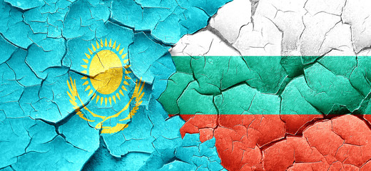 Kazakhstan flag with Bulgaria flag on a grunge cracked wall