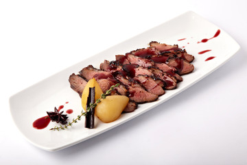 Grilled meat with pear on a white background