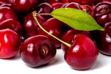 red cherry with leaf isolated on white background