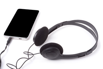 black headphones with the phone isolated on white background