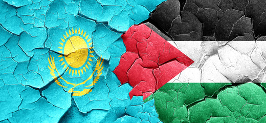Kazakhstan flag with Palestine flag on a grunge cracked wall