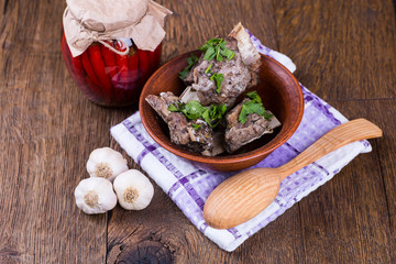 meat with vegetables on a wooden background