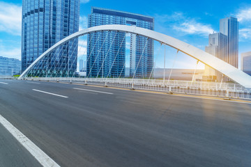 modern buildings with empty road under blue sky,tianjin china.