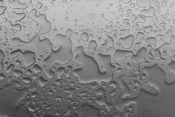 Water drops on silver metal background