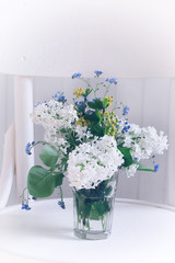 spring bouquet of white lilac white chair Shabby chic romantic retro soft selective focus