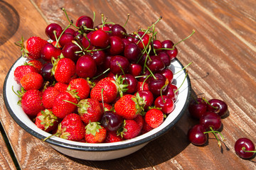 fresh sweet strawberry and cherry in the bowl