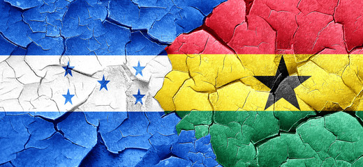 Honduras flag with Ghana flag on a grunge cracked wall
