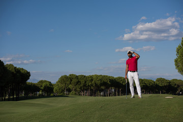 handsome middle eastern golf player portrait at course