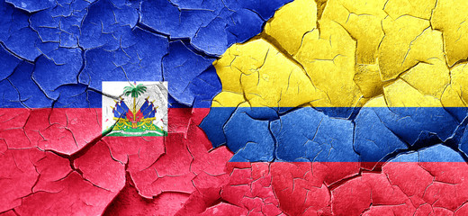 Haiti flag with Colombia flag on a grunge cracked wall