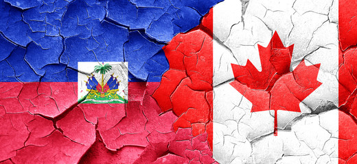 Haiti flag with Canada flag on a grunge cracked wall