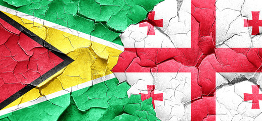 Guyana flag with Georgia flag on a grunge cracked wall