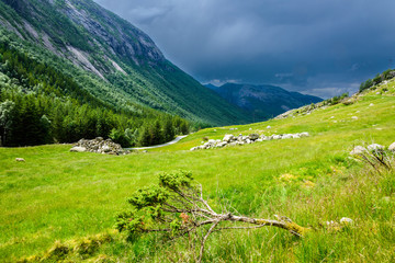 Stormy clouds, hanging over a beautiful valley in Norway