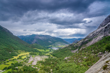 Stormy clouds, hanging over a beautiful valley in Norway