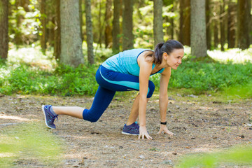 Young fitness woman trail runner with smartwatches ready to run