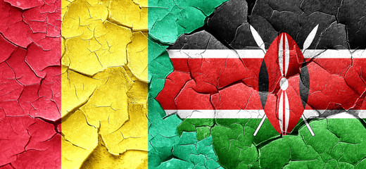 Guinea flag with Kenya flag on a grunge cracked wall