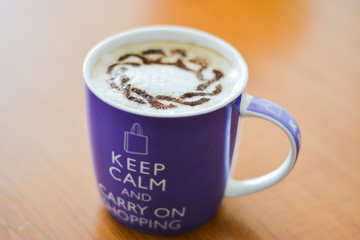 One big cup of cappuccino, white milk coffee in the morning: keep calm and carry on shopping concept