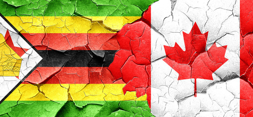 Zimbabwe flag with Canada flag on a grunge cracked wall