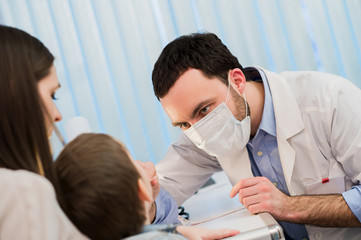 Obraz premium portrait of young male doctor wearing a mask