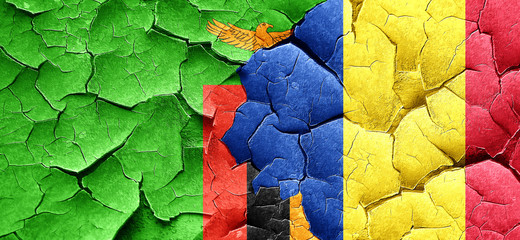 Zambia flag with Romania flag on a grunge cracked wall