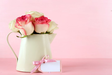 Happy Mother's day concept. Roses in a vase and empty card