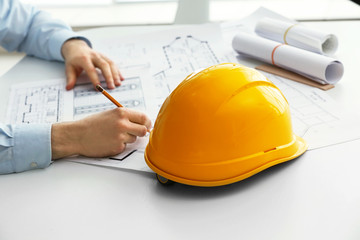 Male construction engineer working in the office