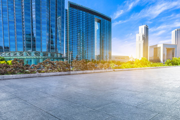 Fototapeta premium empty tiled floor and urban skyline,tianjin china.