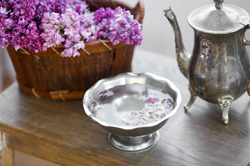 Bouquets of purple lilac spring flowers on wooden background
