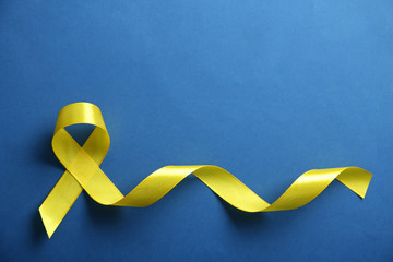 Yellow ribbon on blue background