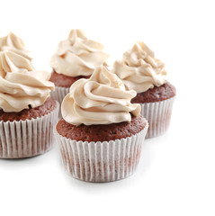 Tasty chocolate cupcakes, isolated on white